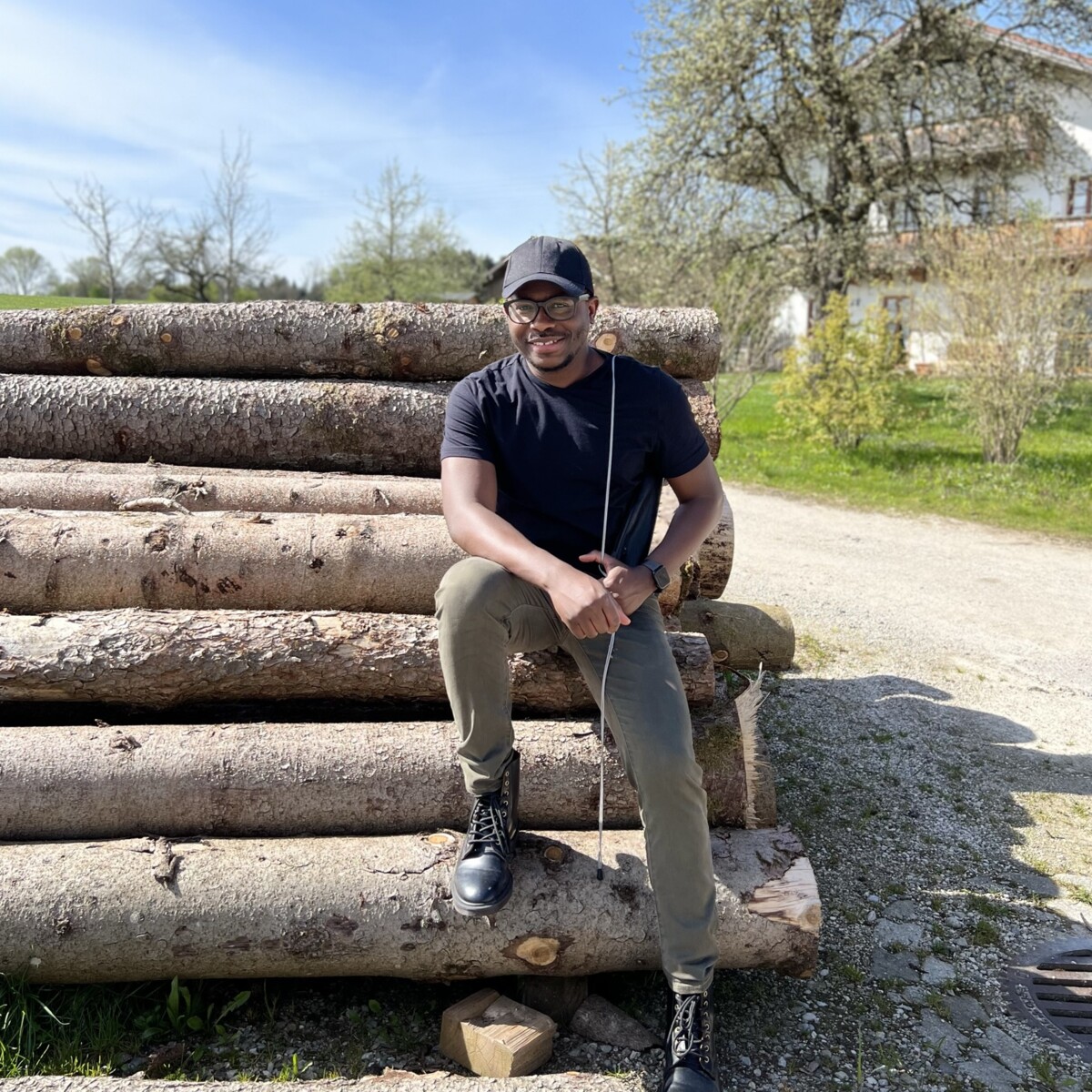 Meet Philip Ayiku Dzagbletey sitting outside.