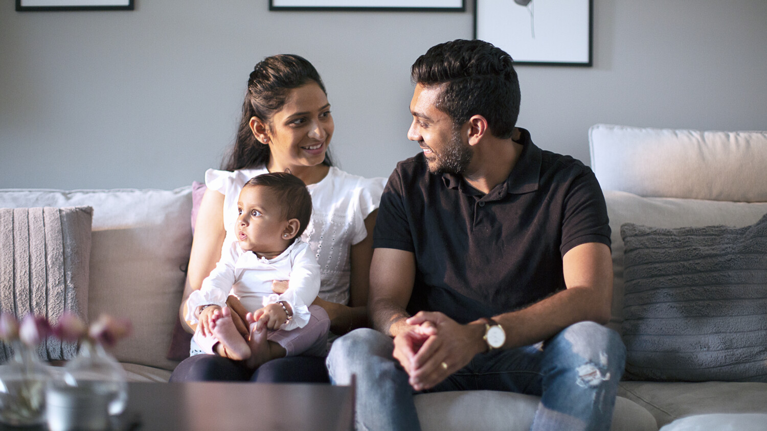 Family sitting together with child.
