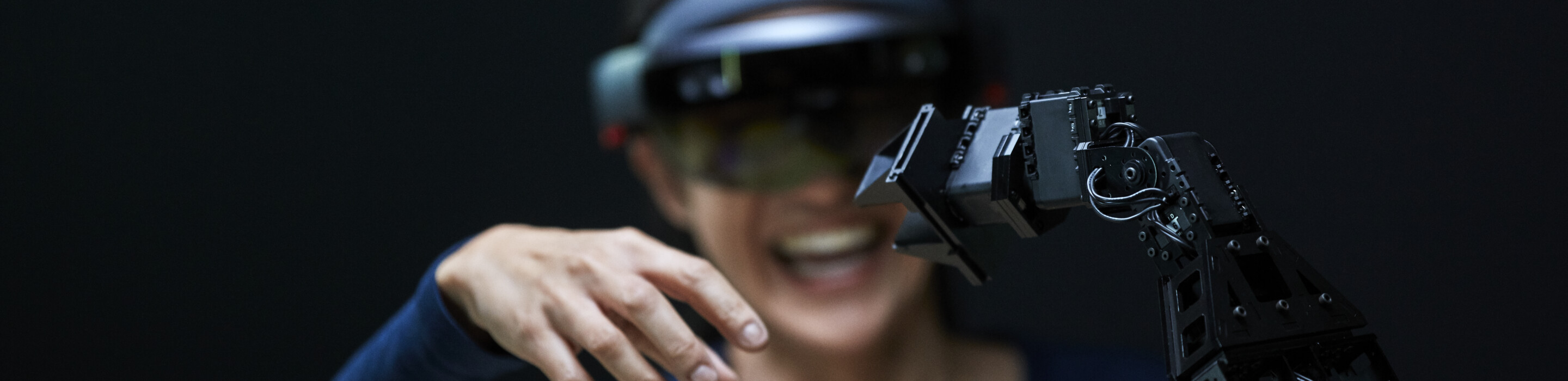 Woman using AR with robotic arm