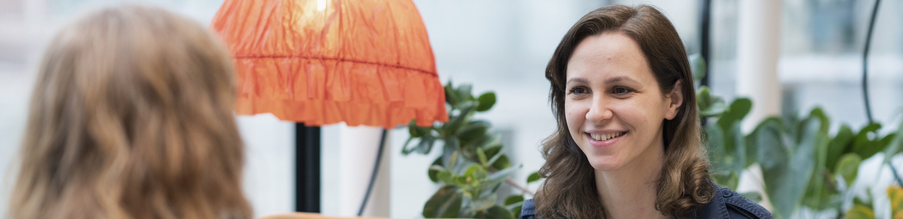 Women discusing in a lounge