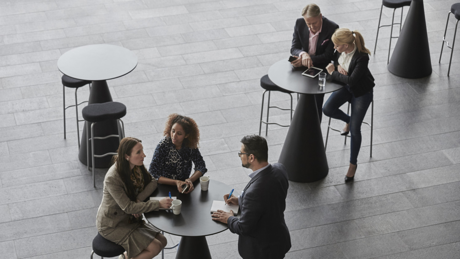 Ericsson employees talking around a table