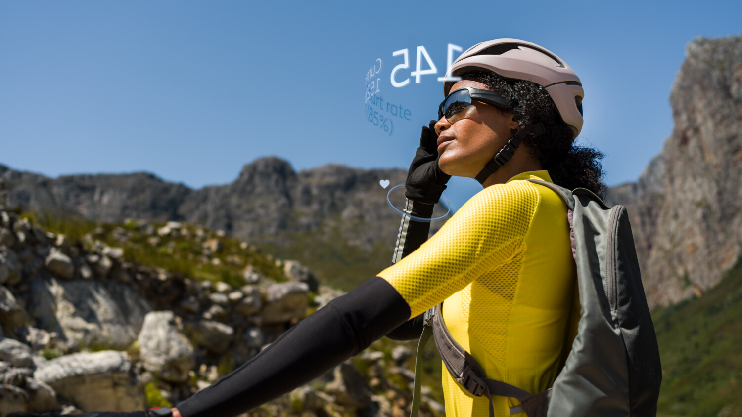 Woman athlete checking her pulse using her AR glasses.