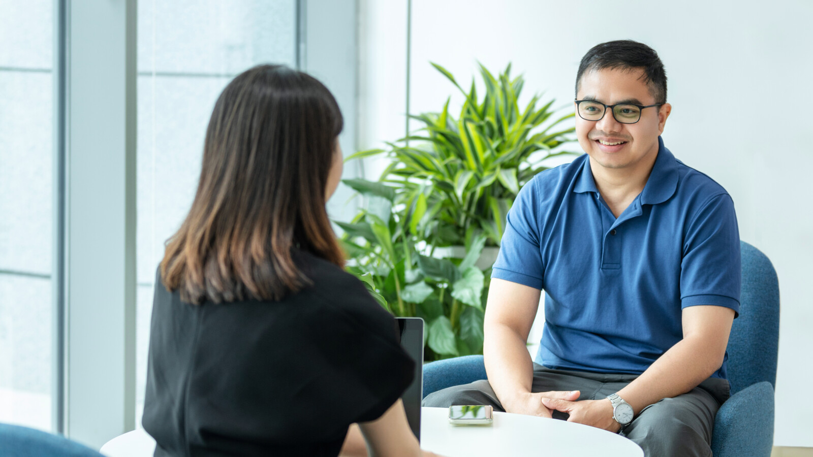 Ericsson 5G factory Nanjing man and woman are sitting in lounge