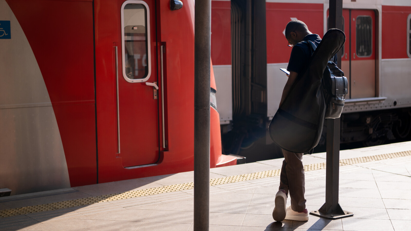 Man standing near train