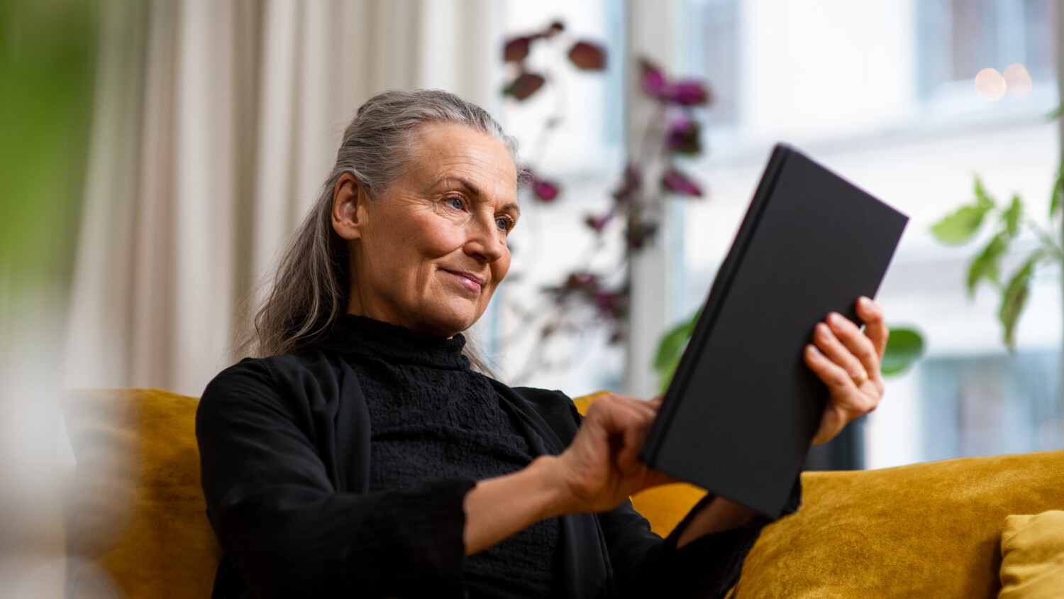 Woman using a tablet with 5G connectivity