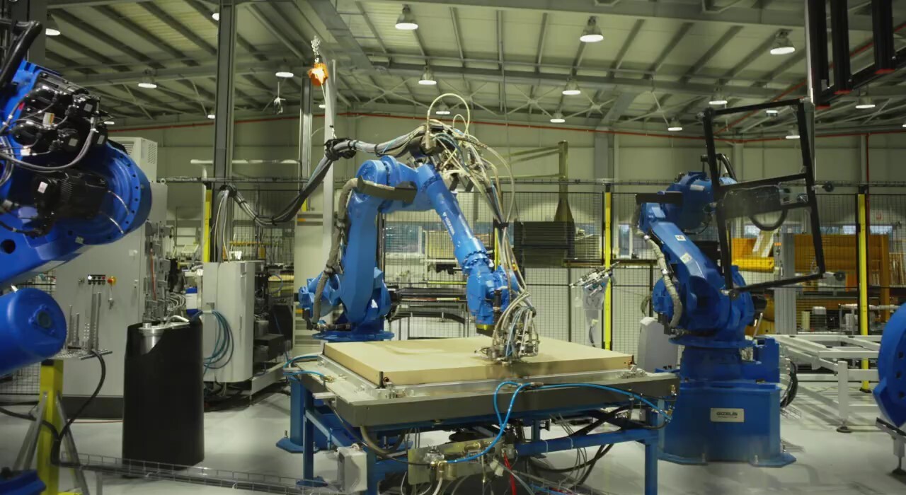 Robotic arms in production facility