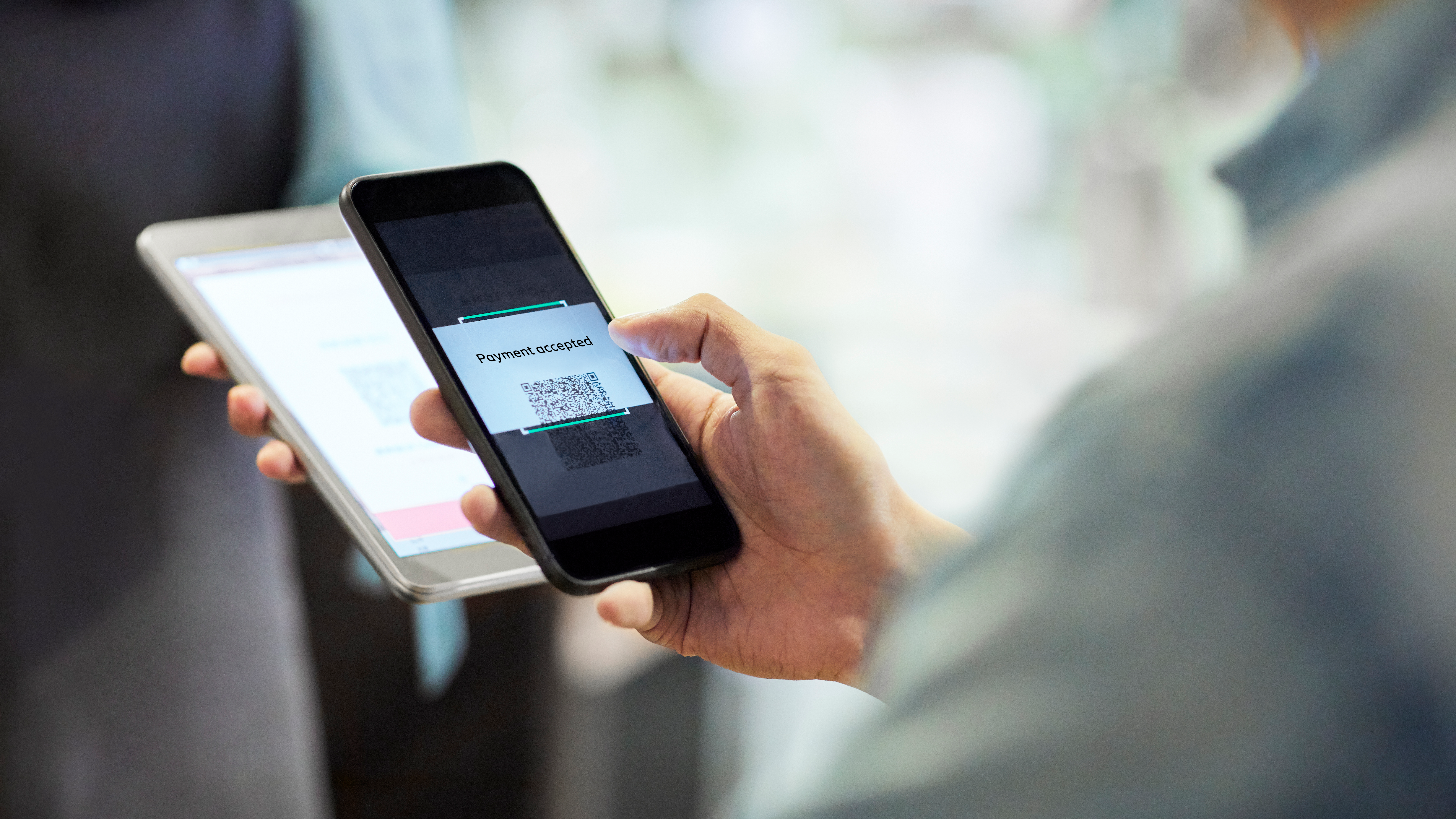 Person paying with mobile phone.