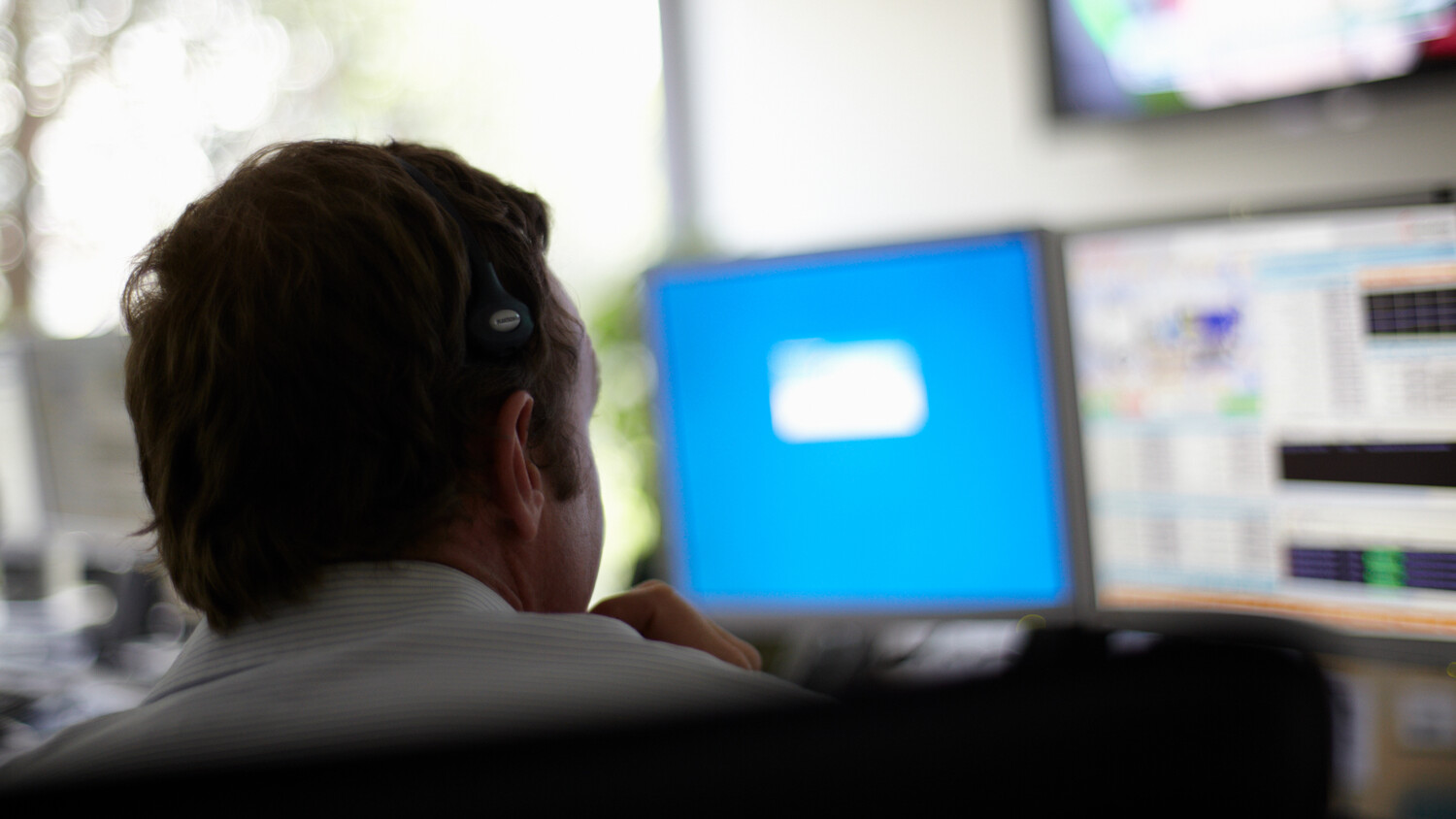 Man looking at monitor.