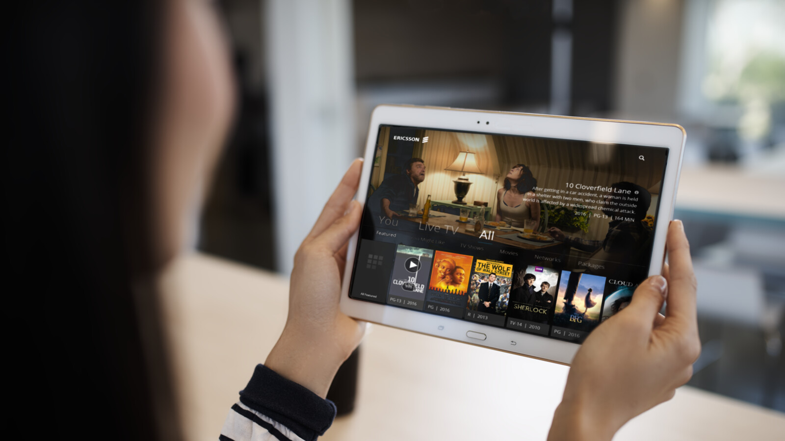 Person using streaming service on tablet.