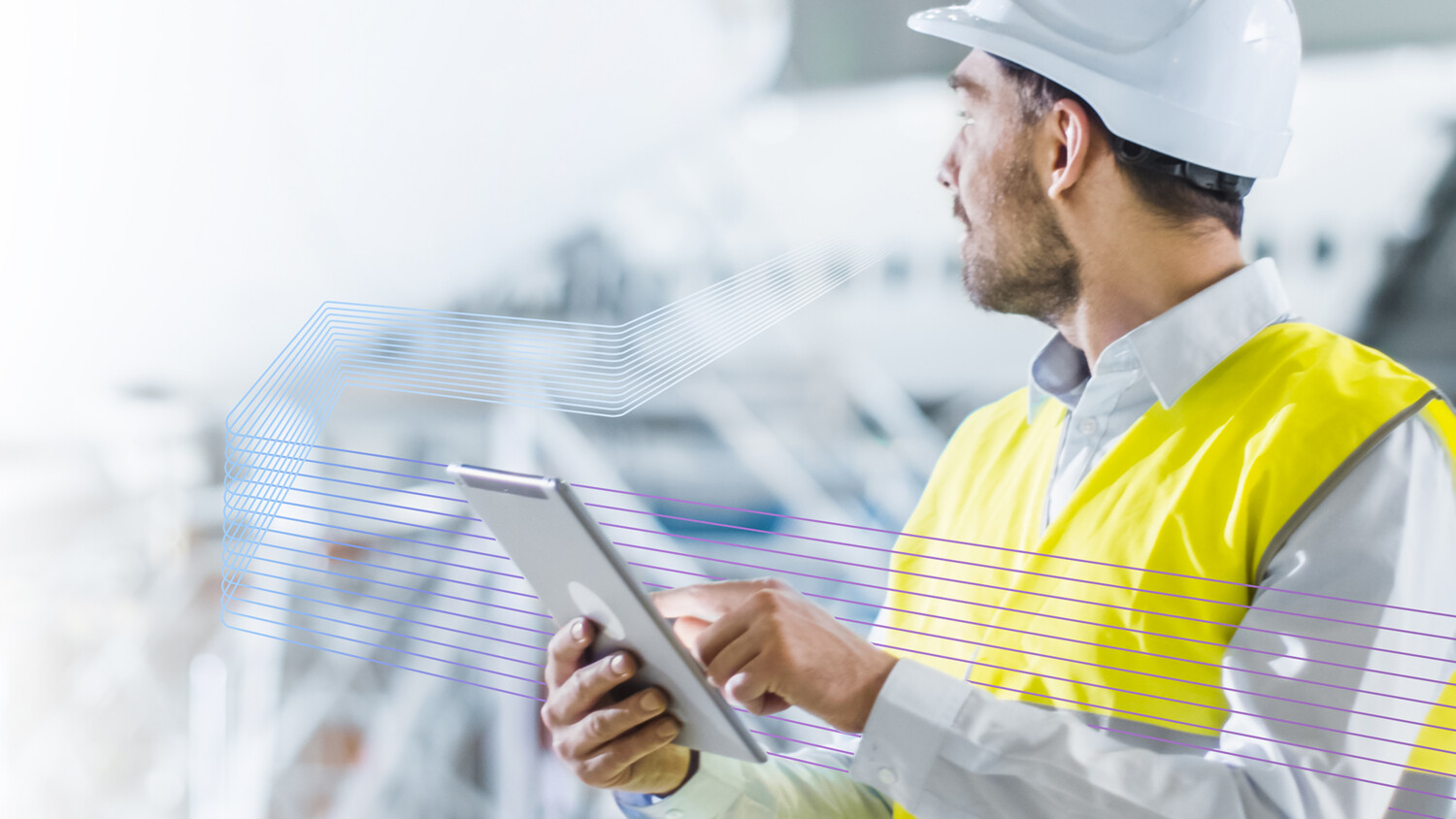 Construction site engineer with a tablet.