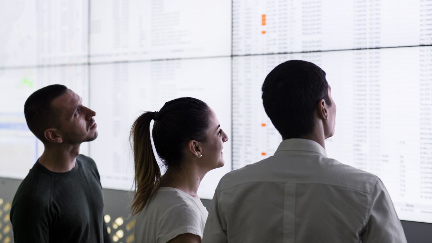 Three management consultants analysing data