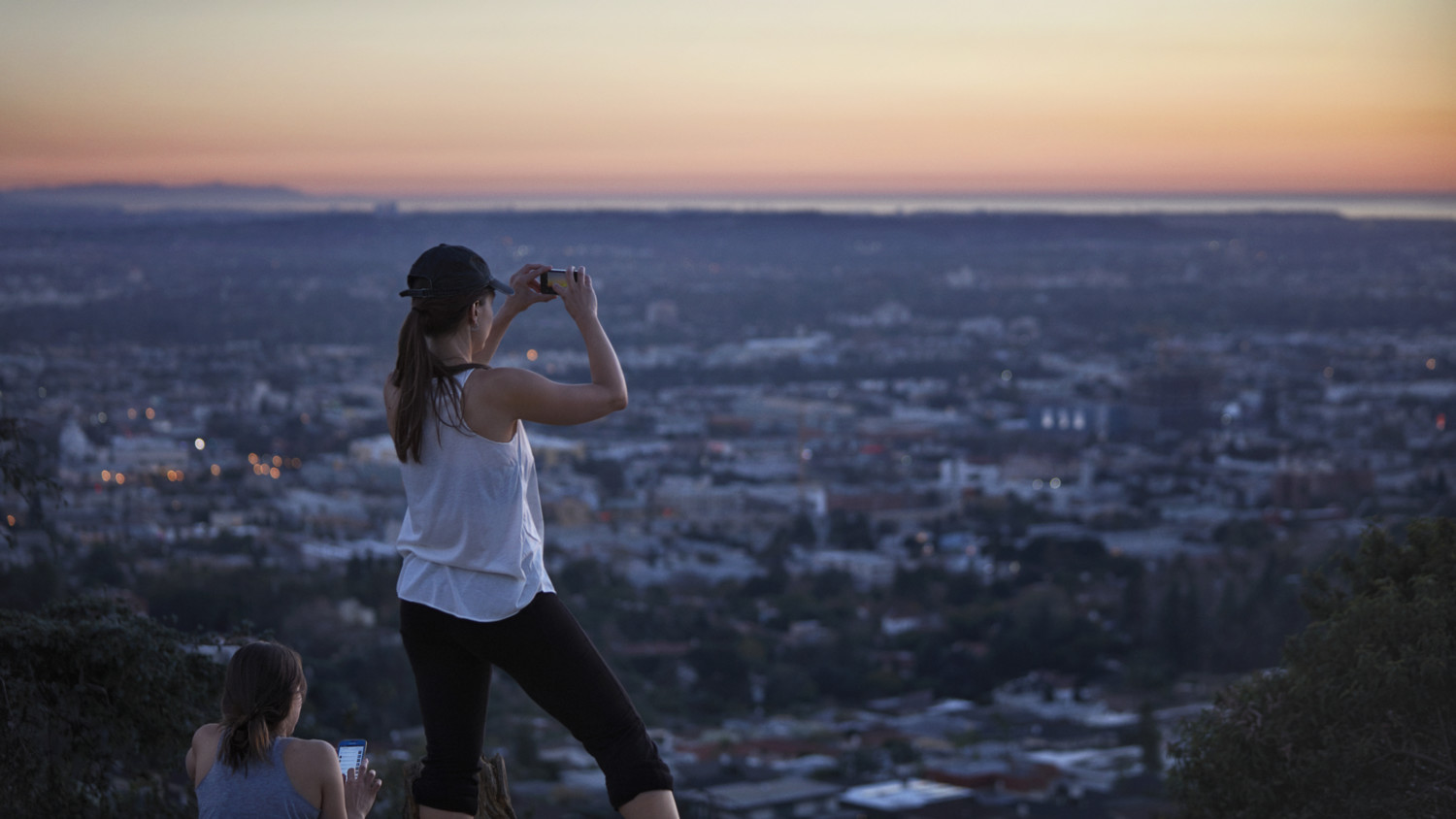 Woman taking photo of city view