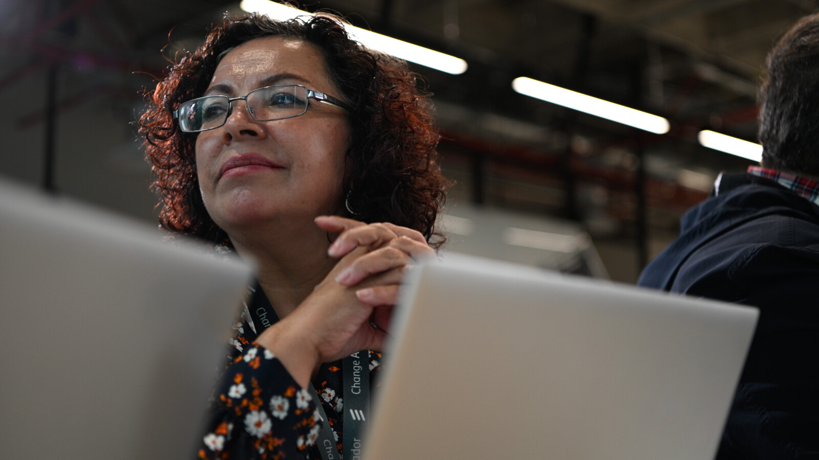 A woman in meeting with her colleagues