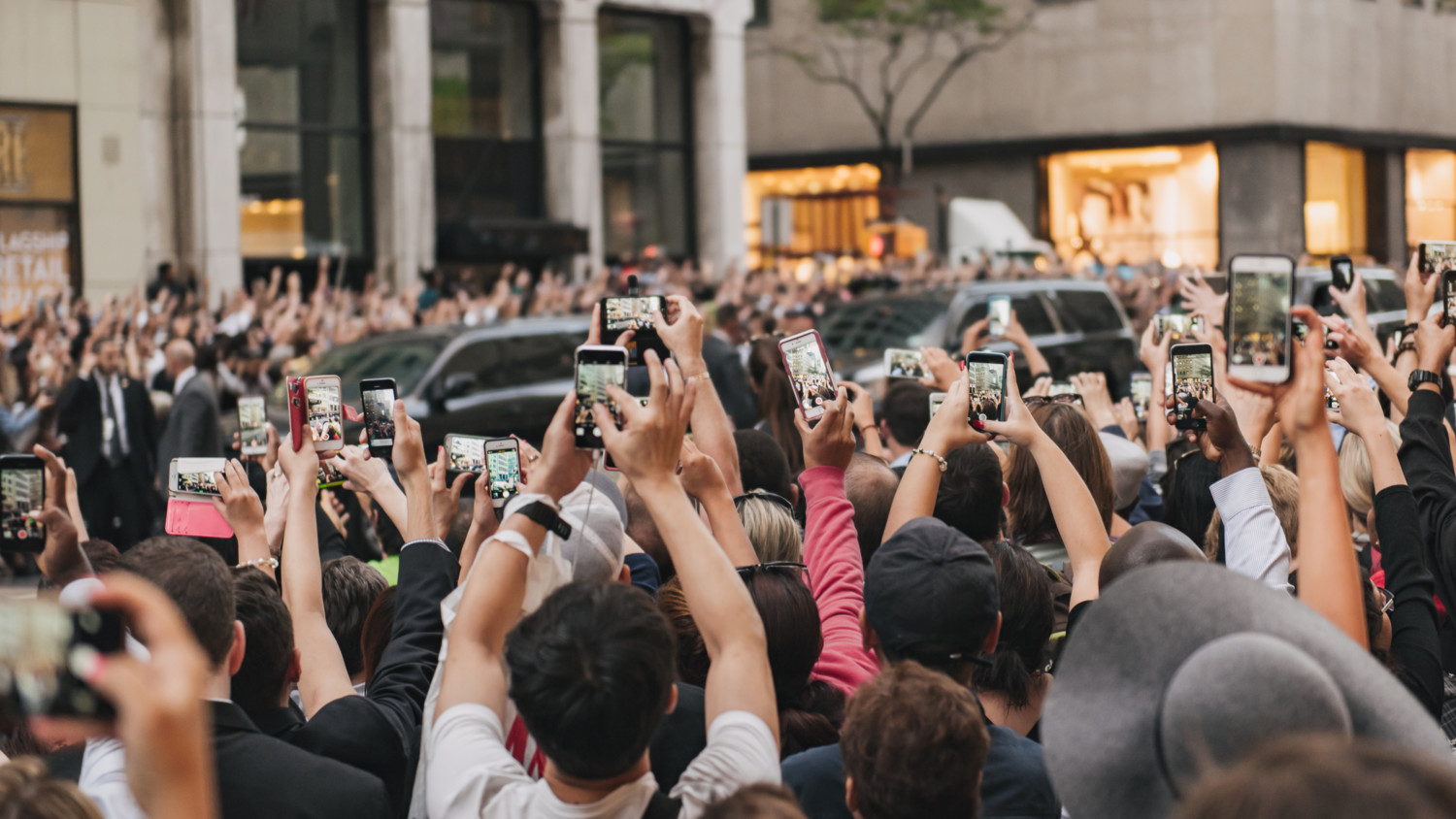 Crowd taking pictures with their smart phones ones