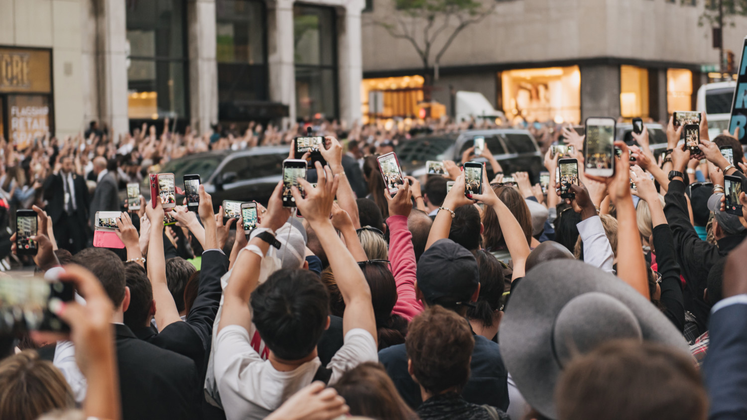 People taking photos with their mobile phones