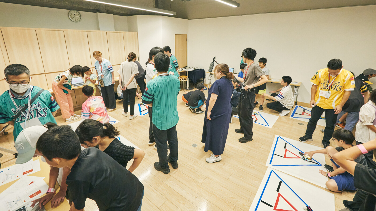 Scenes from the “H.E.R.O Lab” robotics education program held in September 2025