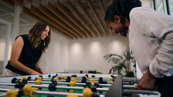 Employees taking a break playing an indoor game.