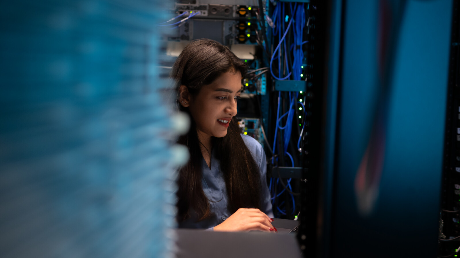 Woman working in server room
