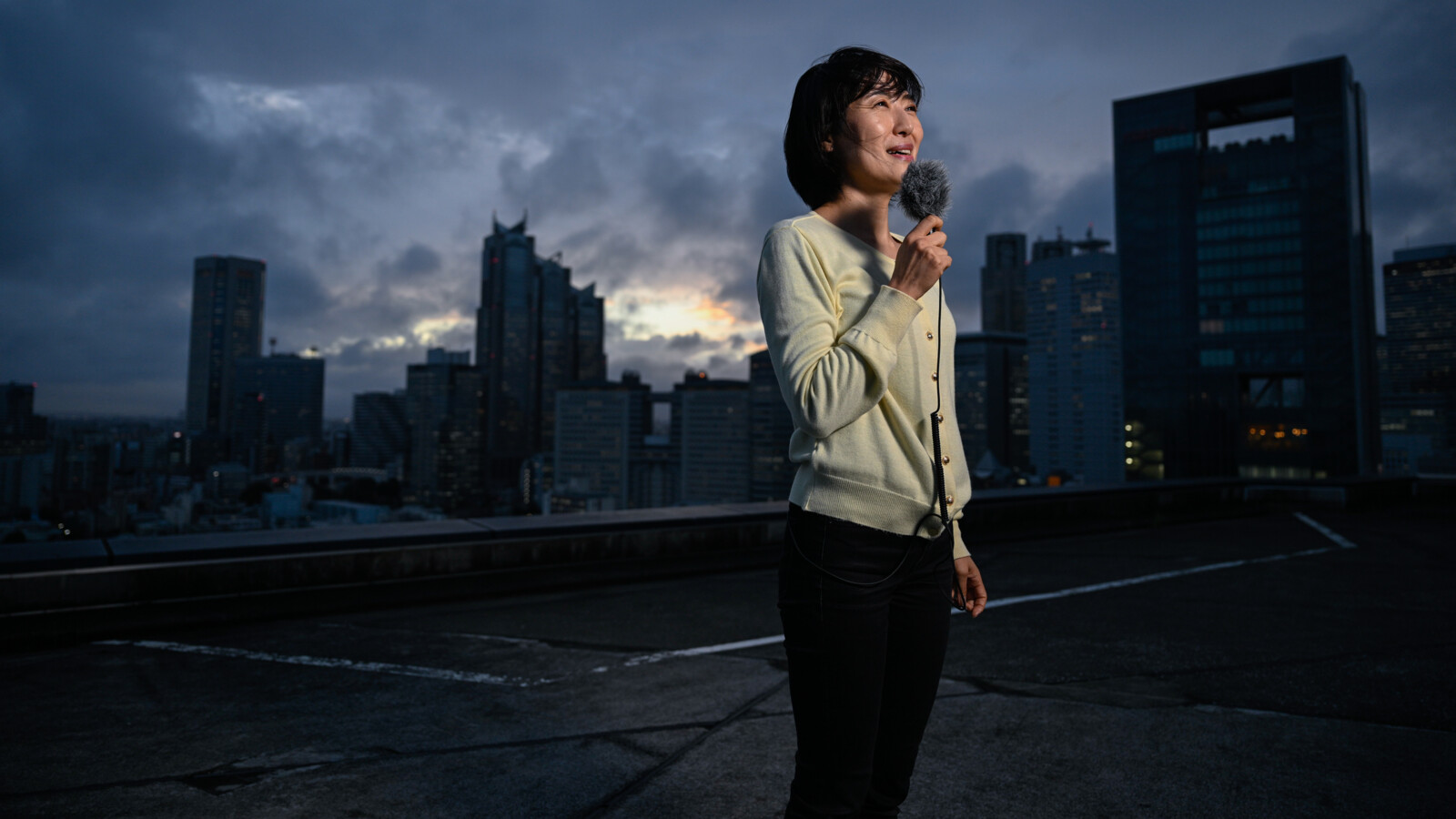 Remote broadcast presenter on a rooftop