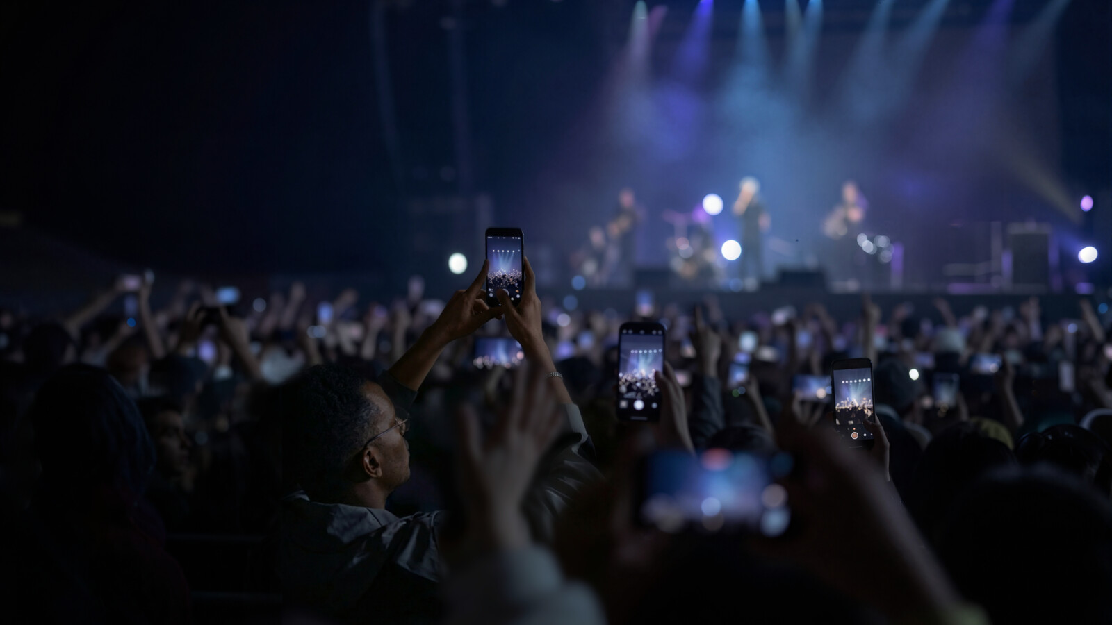 Smartphones raised during live concert