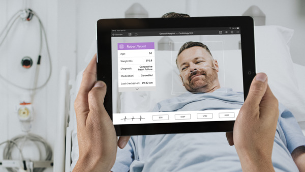 Men resting on bed with screen 