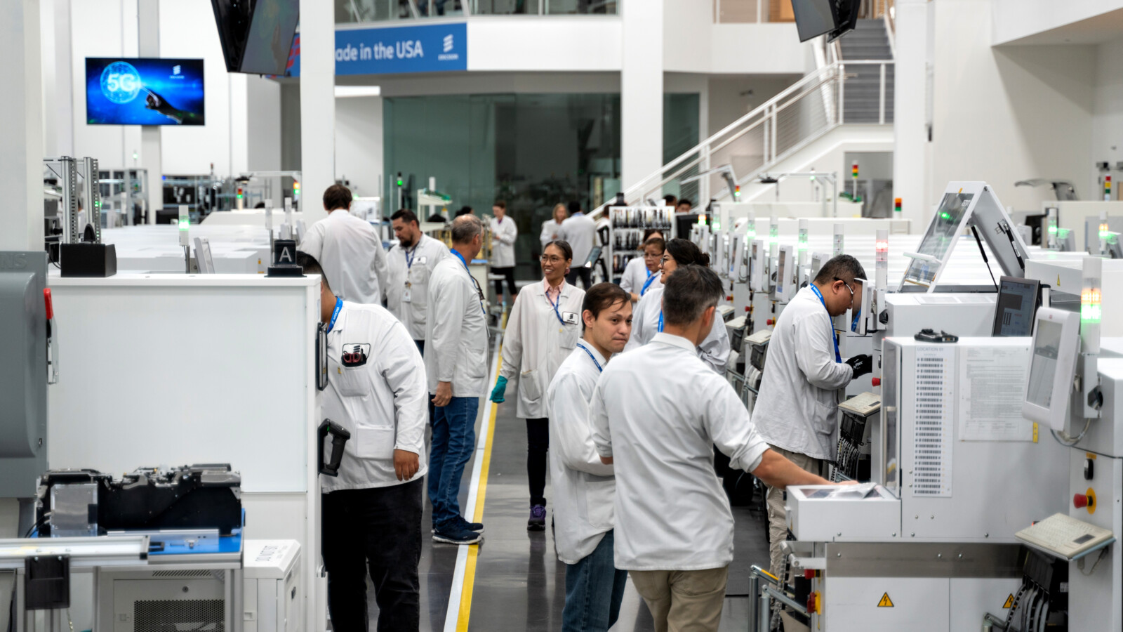 Factory personnel operating equipment