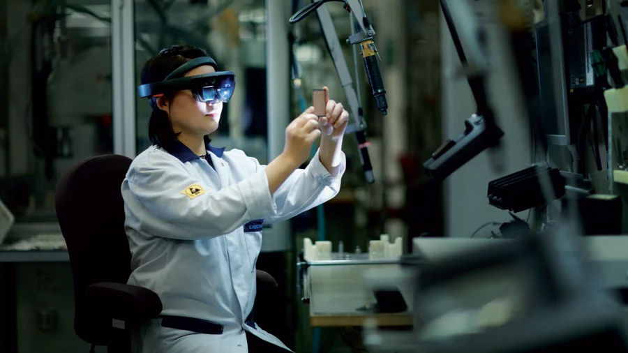 Woman in factory in vr glasses.