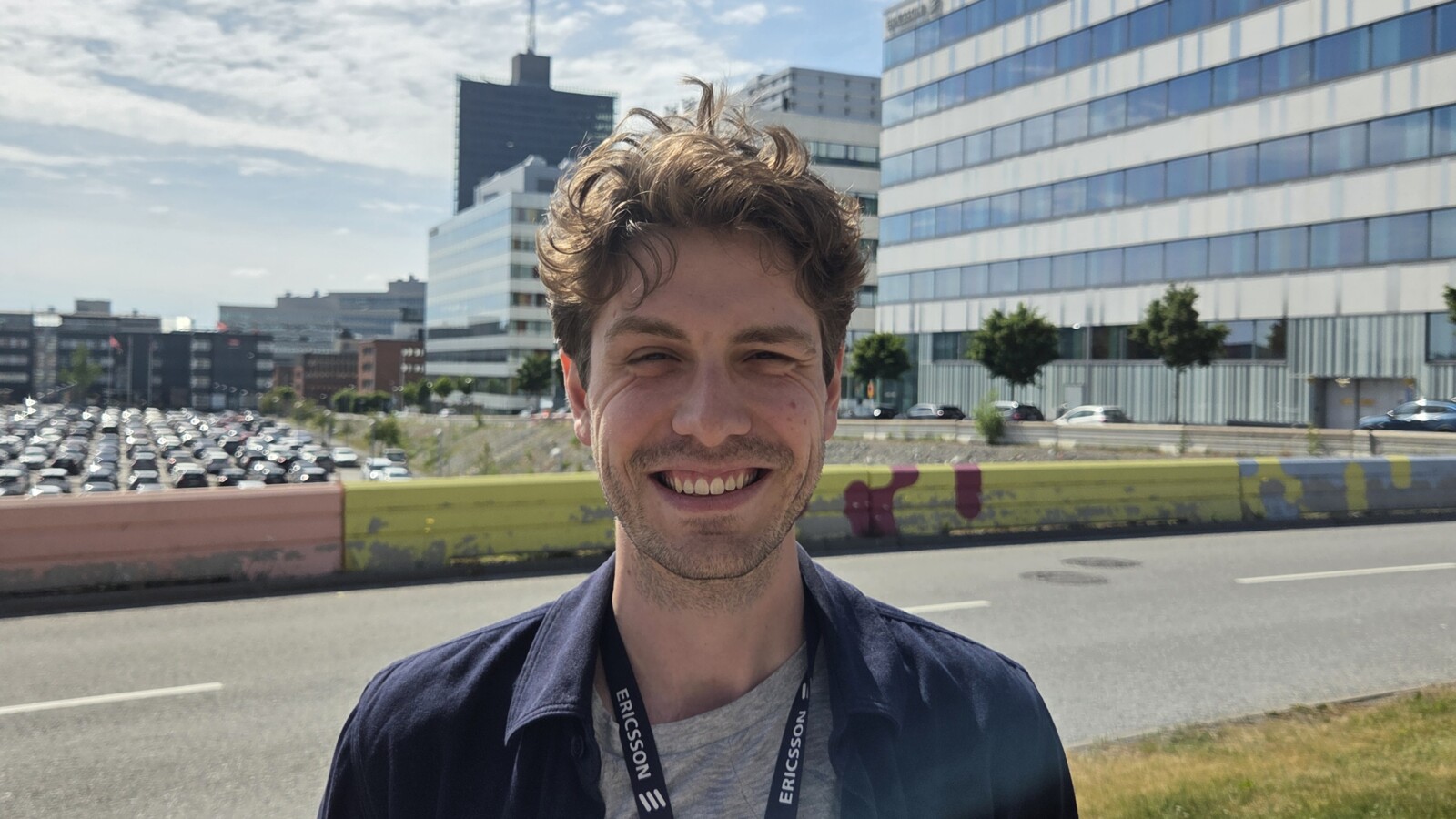 Nils Fredrikson smiling outside of the Ericsson office