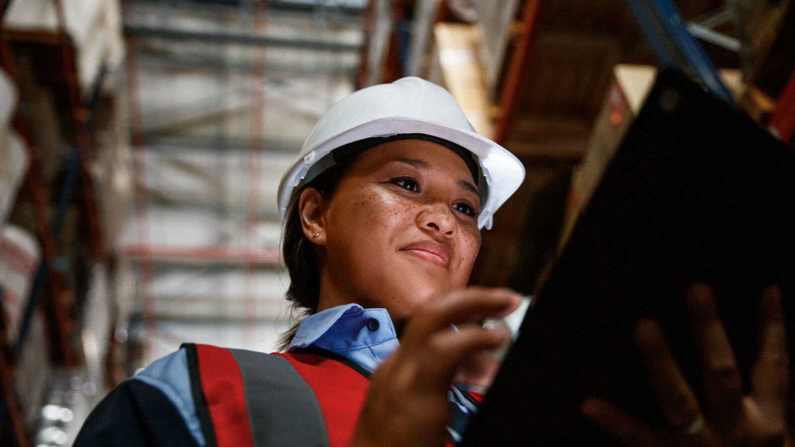 Woman checking warehouse goods with the help of 5G