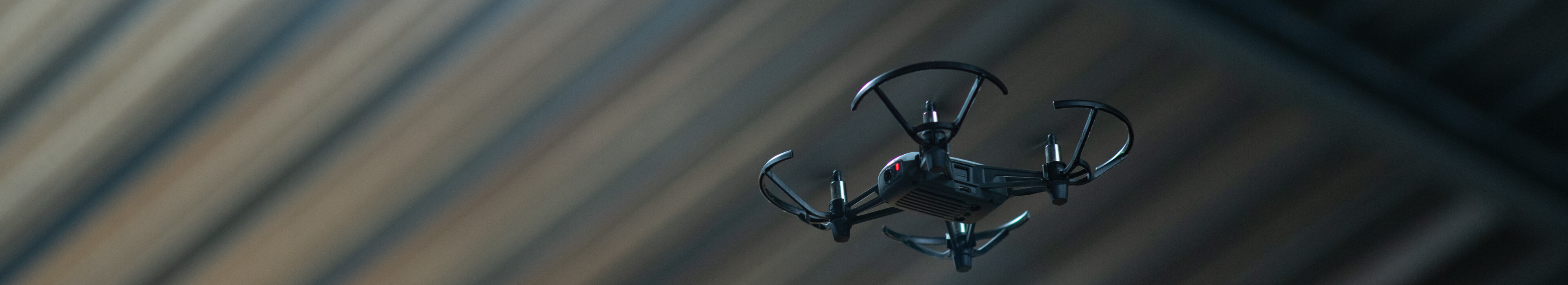 A drone shown against a corrugated ceiling in a research lab