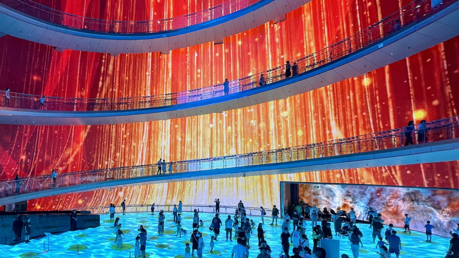 Exhibition with dynamic LED screens and visuals.