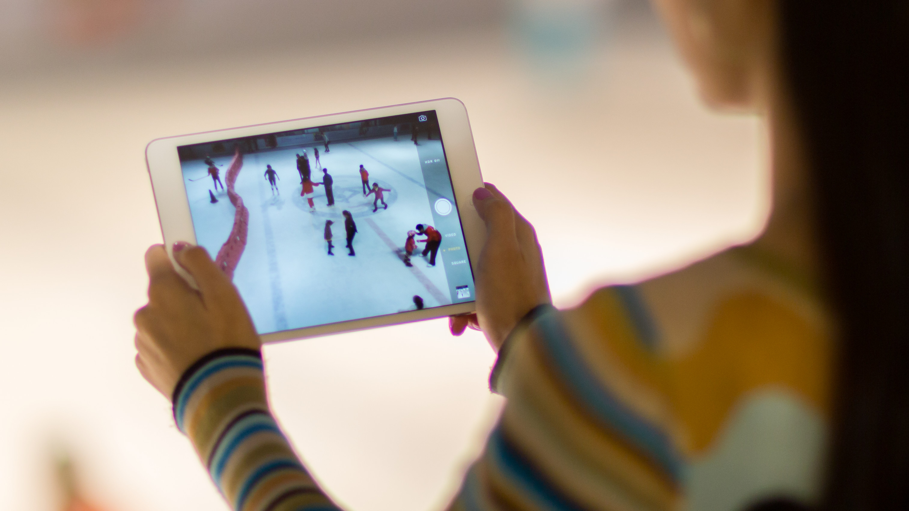 woman streaming a movie on a tablet