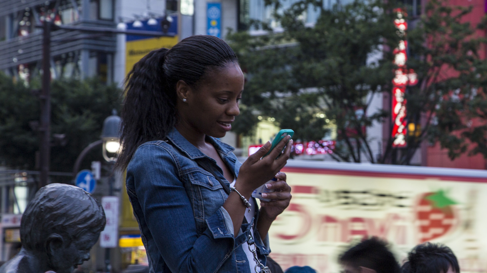 A girl looking at mobile device