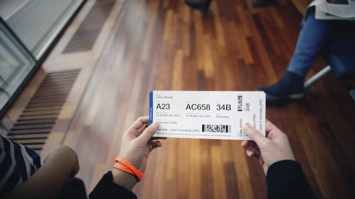 Hands holding a planeticket