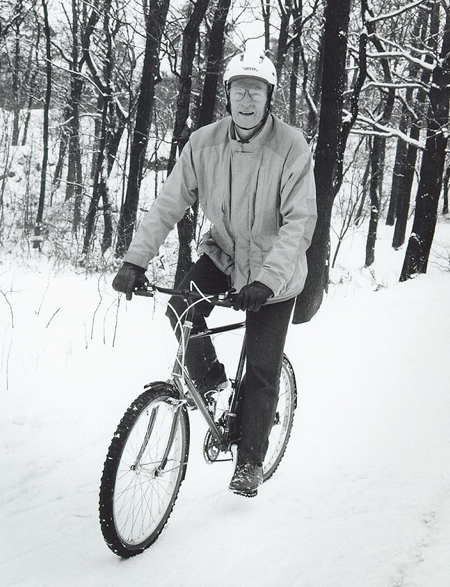Magnusson, B G, engineer (on bike, 1980s)