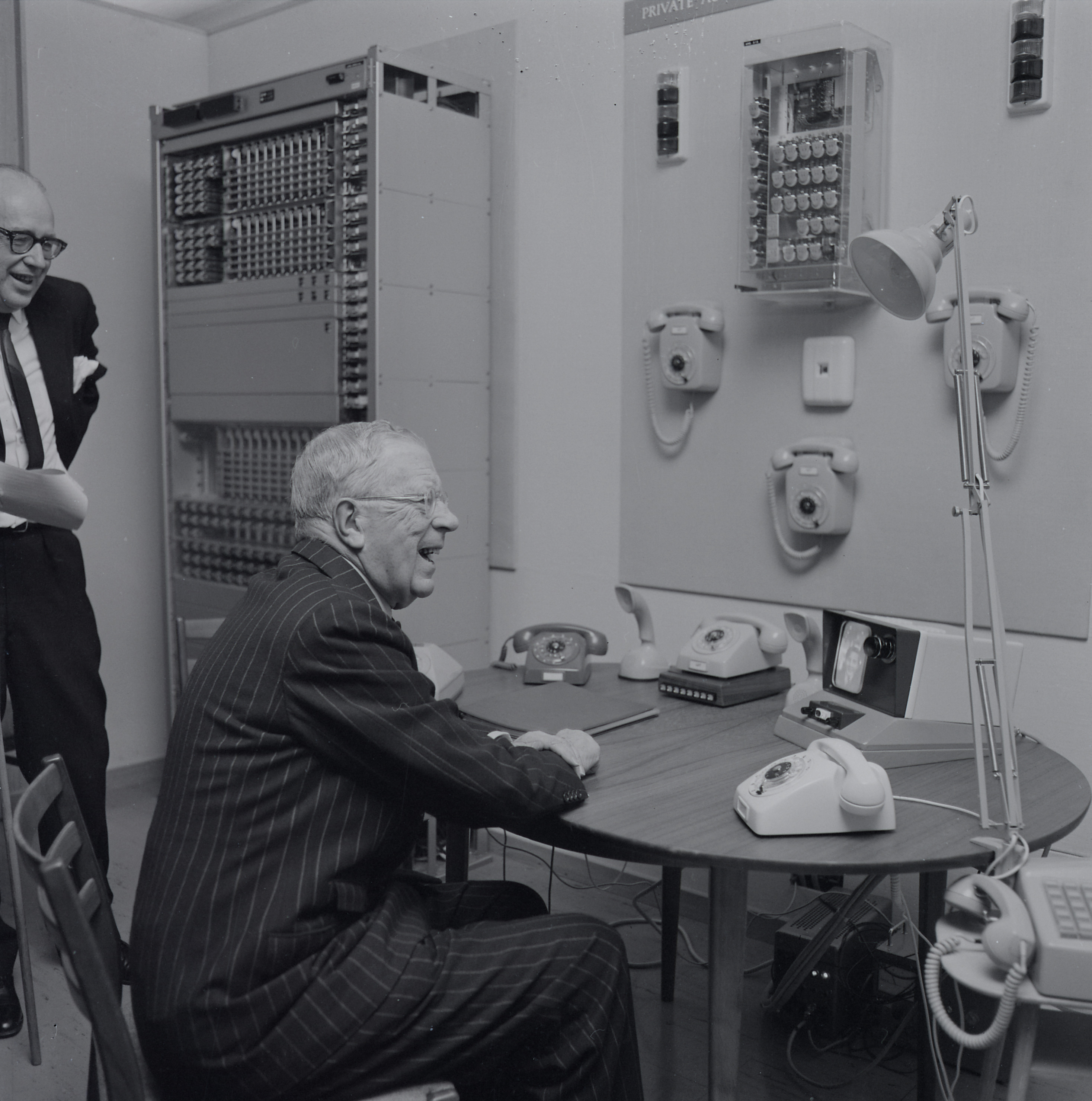 King Gustaf VI Adolf of Sweden is trying out the picture telephone system.