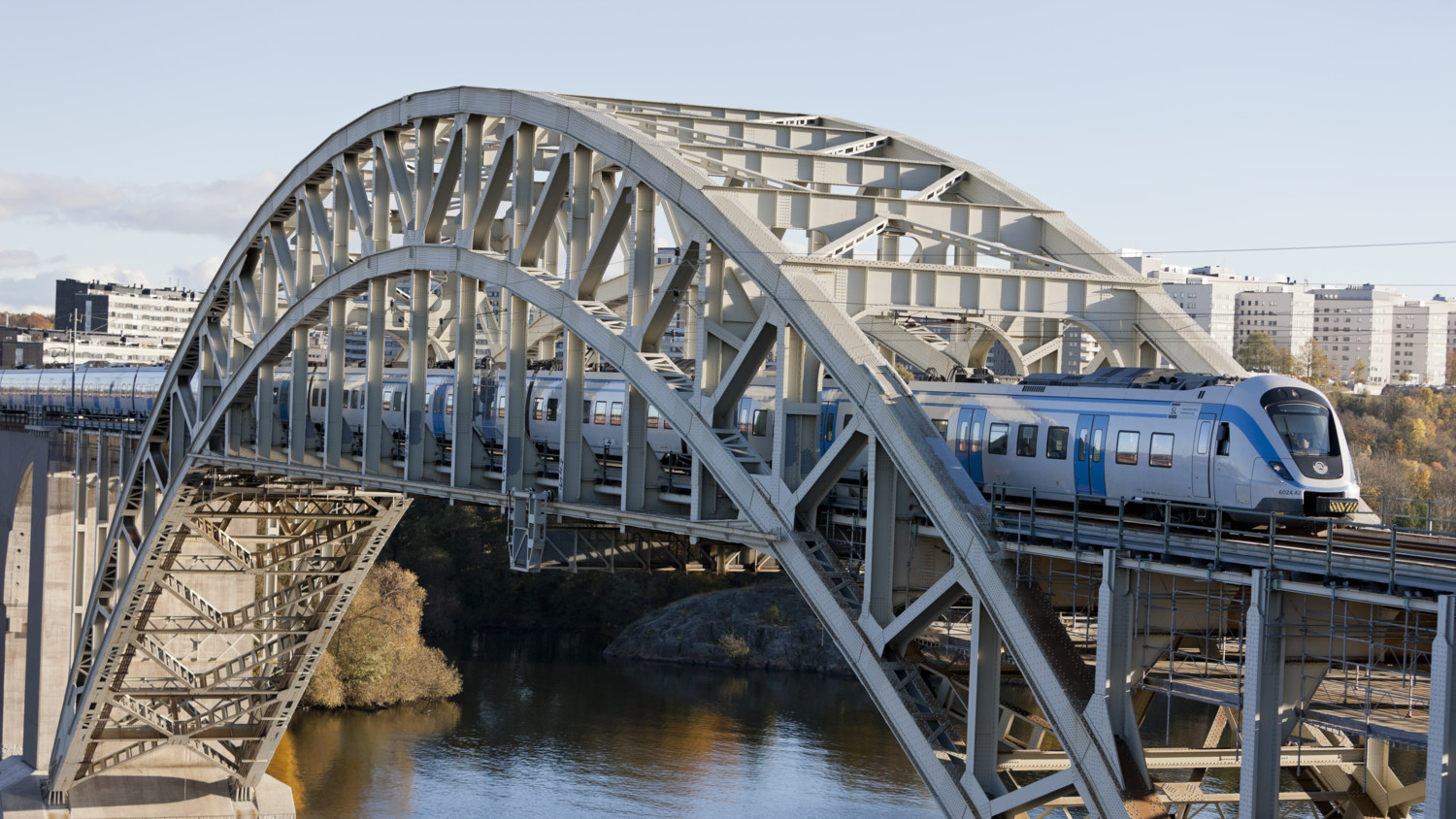 Train on bridge over lake