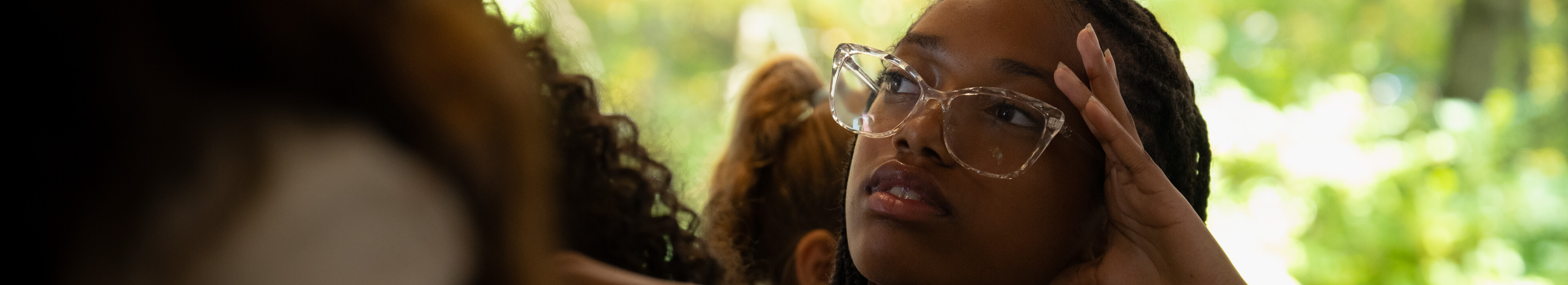 Image of a young student concentrating in a classroom