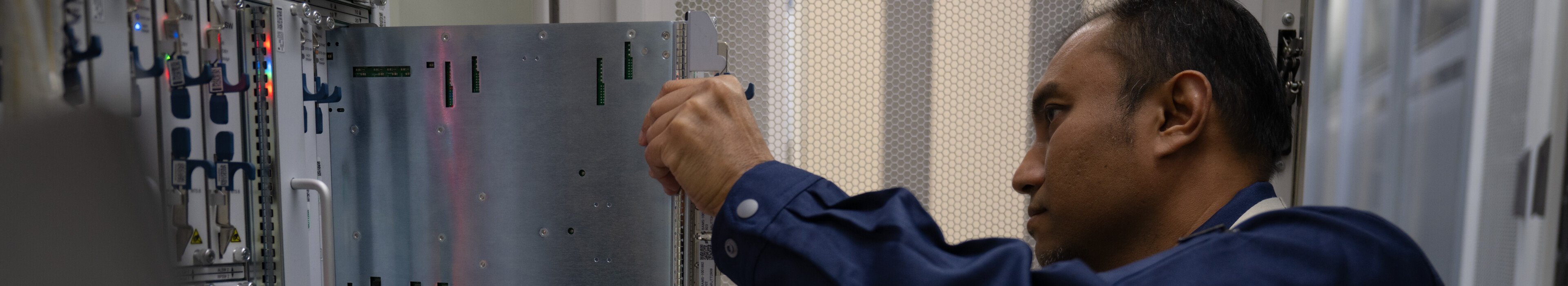 Male technician checking server