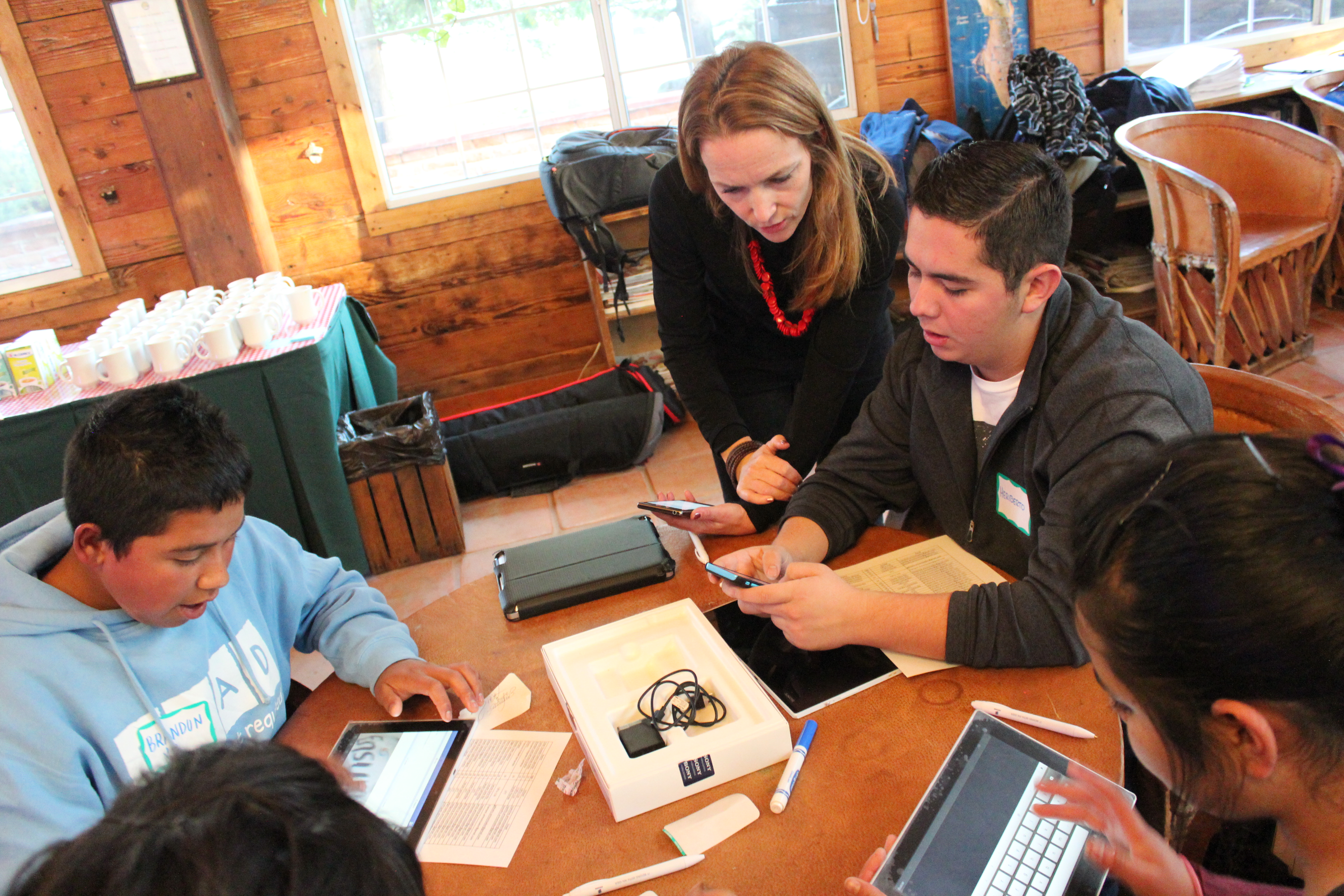 Elaine showing students tablets