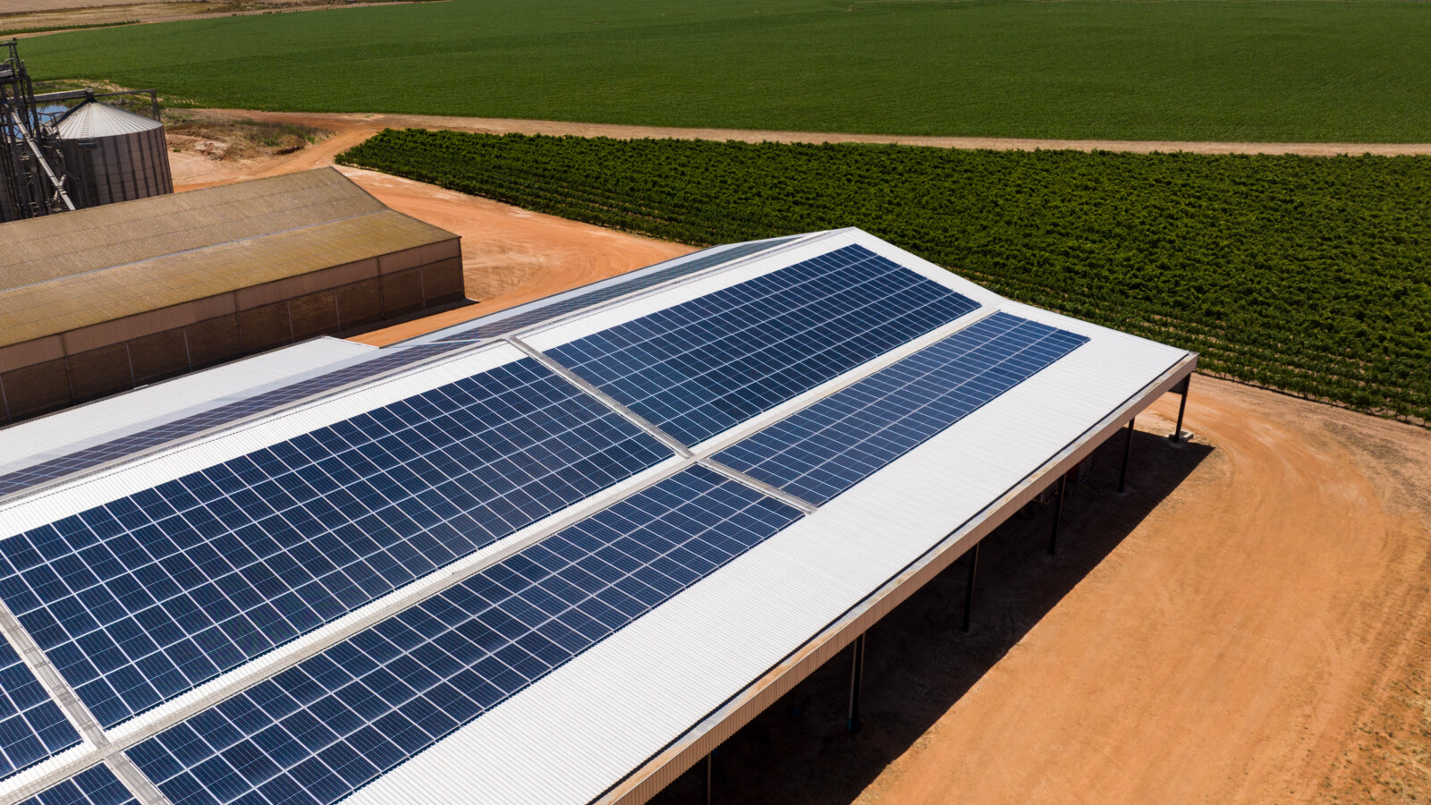 Solar panels at a farm next to fields