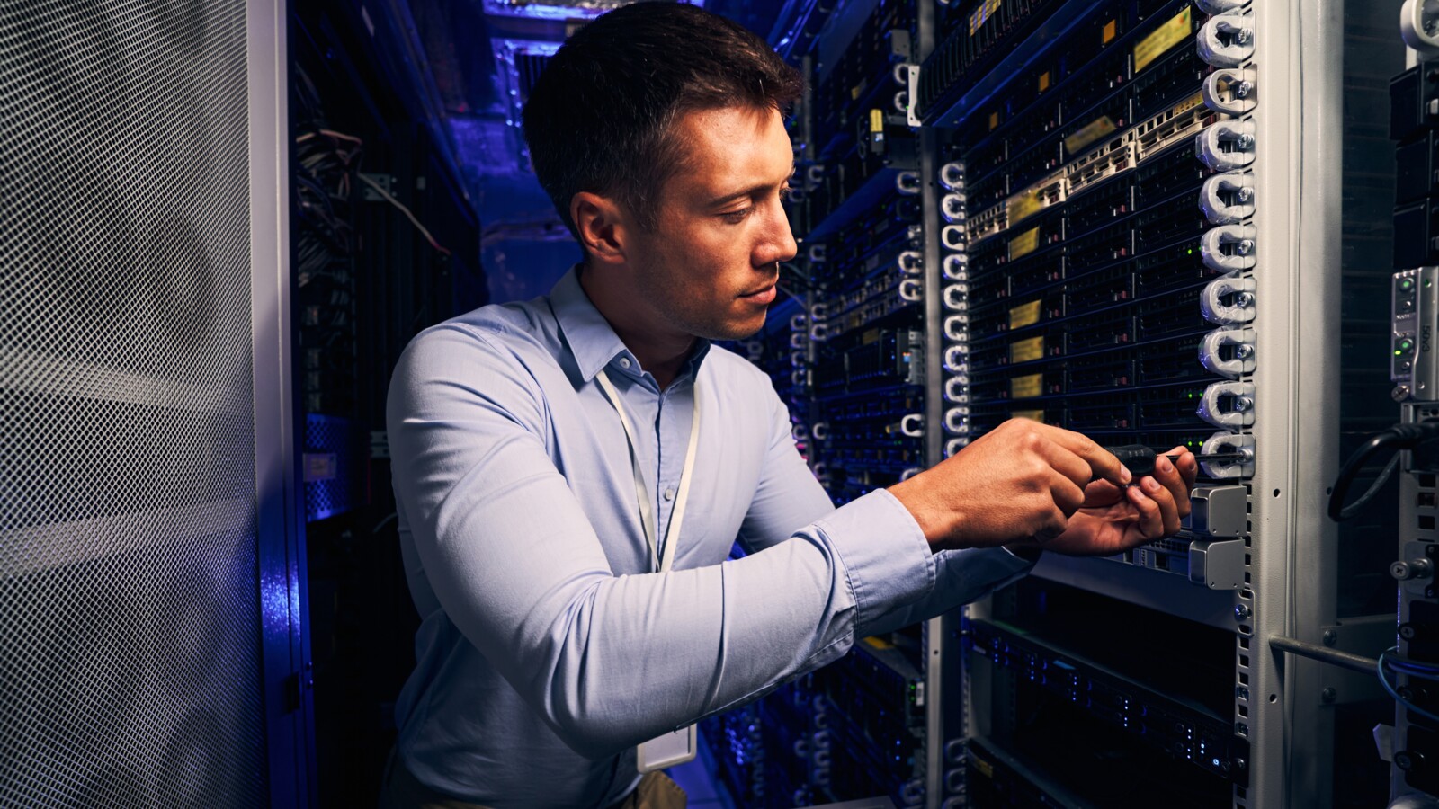 Technician working on server room