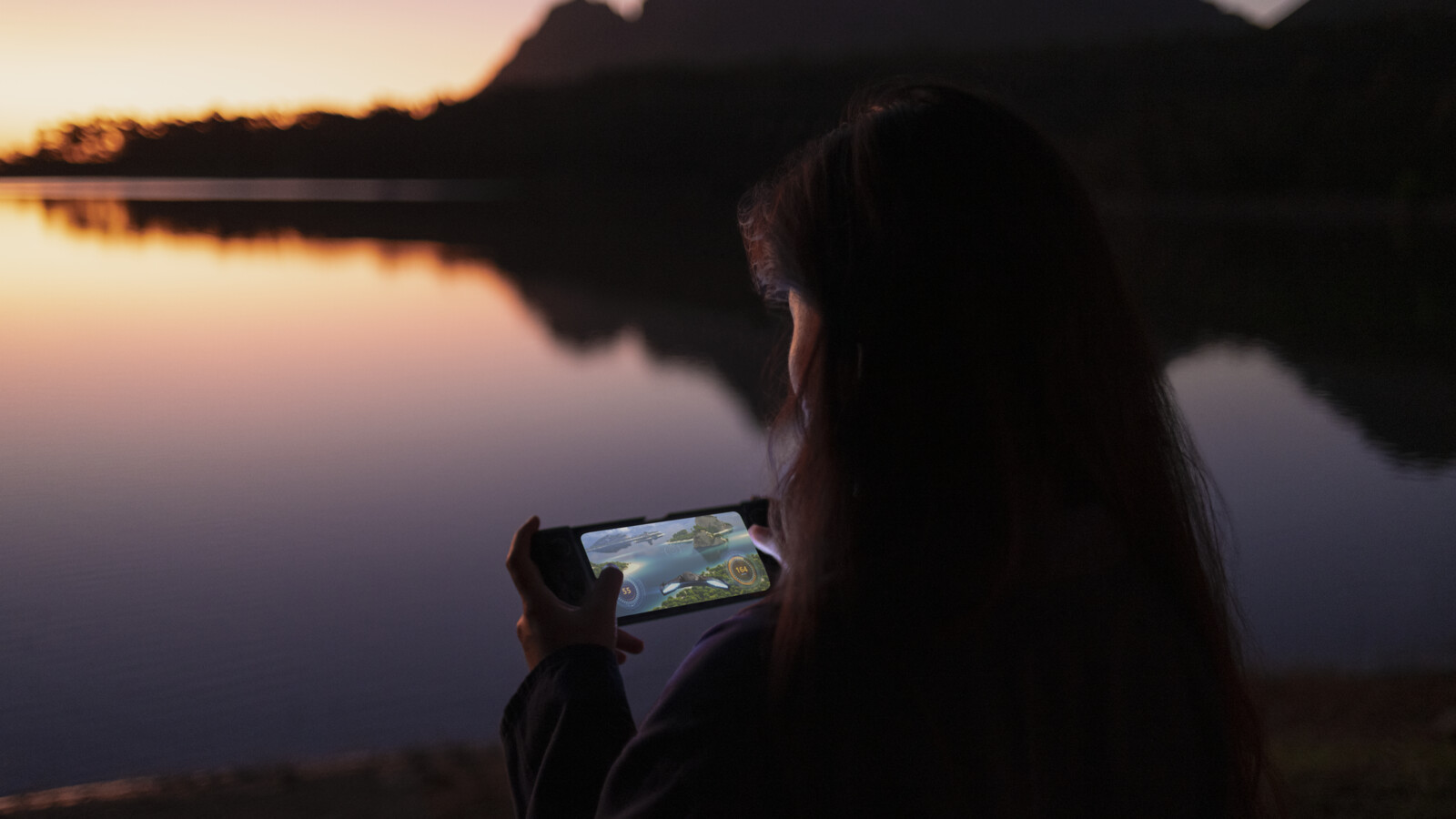 A woman playing a game over 5G on her phone