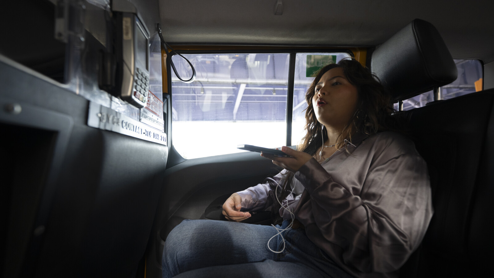  A woman inside a car making a voice call