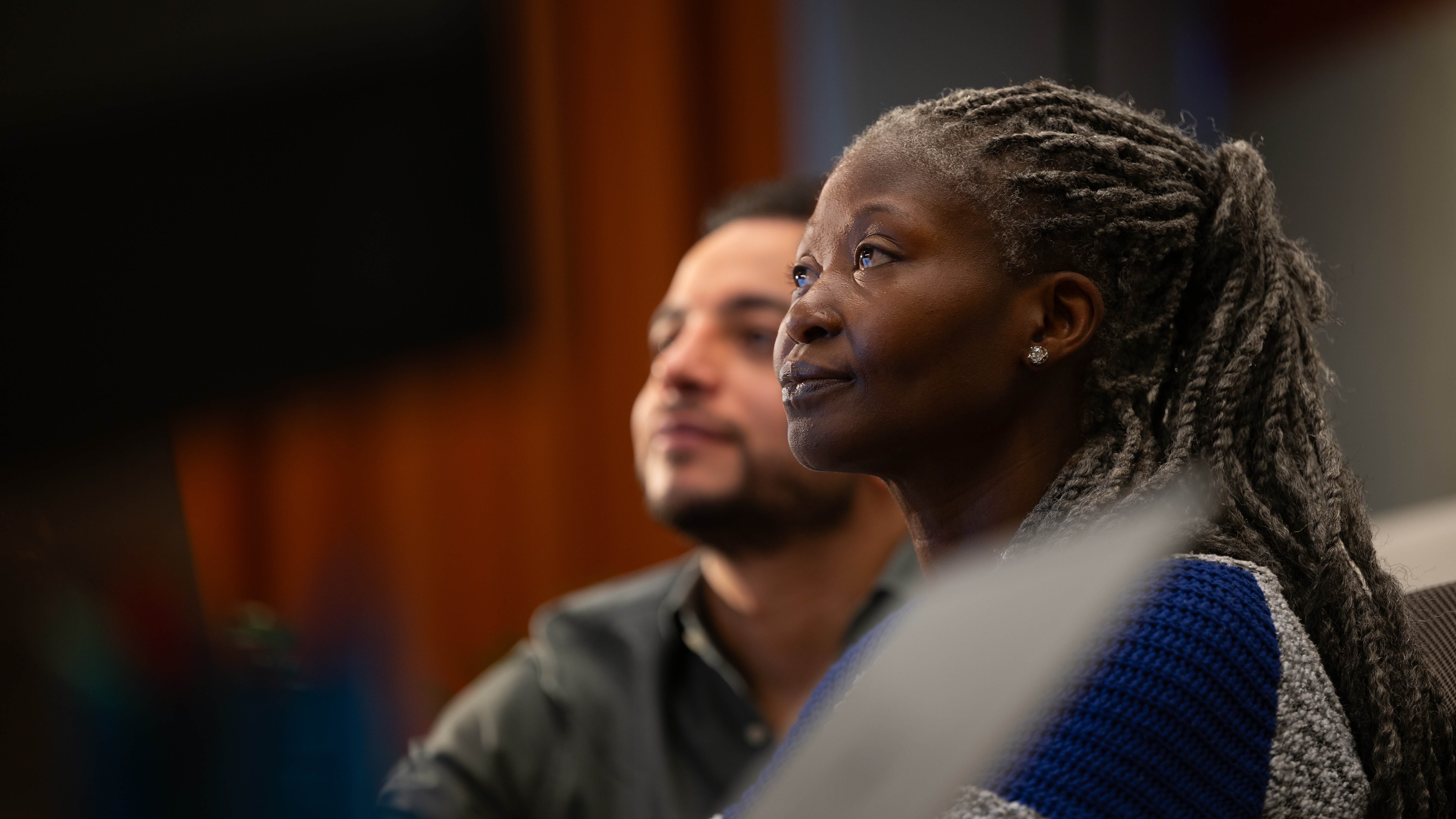 Woman and man attending a meeting