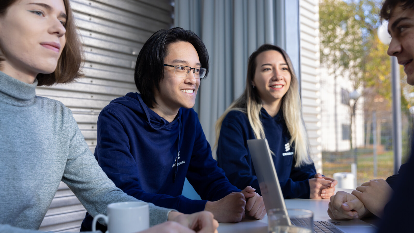 A diverse team of young talents having a discussion