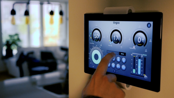 Image of the interactive tablet interface used for managing home appliances, heat and lighting.
