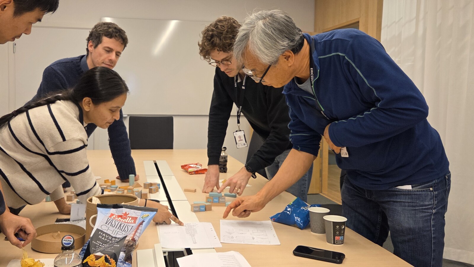 Michael and his team working together in a conference room