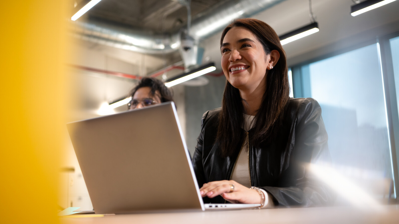 A woman smiling and working