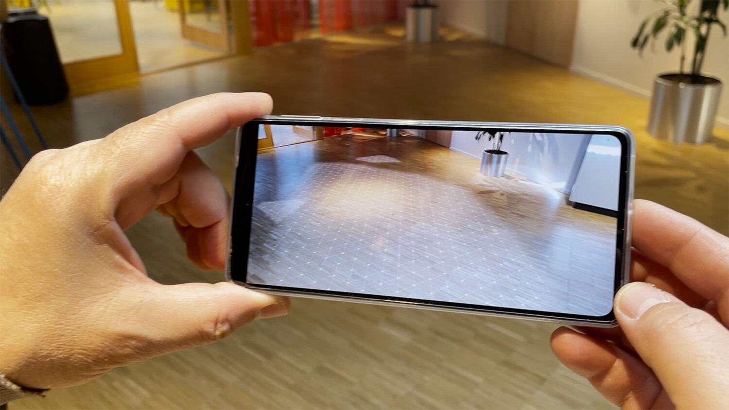 Watch the demonstration of a live concert in augmented reality viewed on a smartphone, with digital avatars participating in real-time.